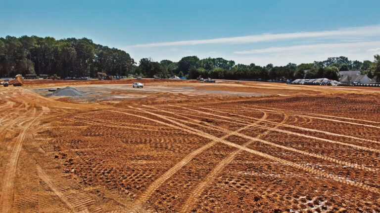 Excavation services and top-notch equipment preparing construction site for foundation | Scotty’s Land Specialist